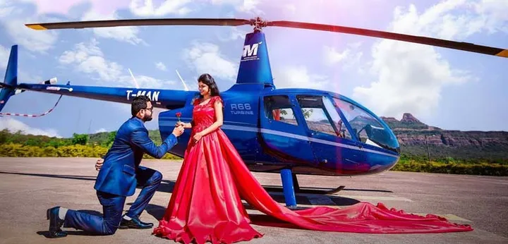 Bride and groom arriving by helicopter for wedding