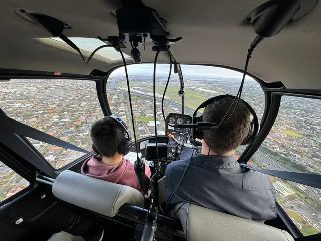 Happy family with children enjoying helicopter scenic flight