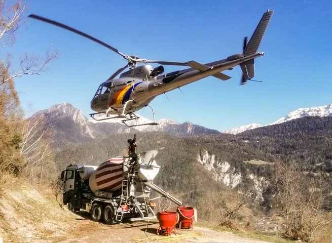 Helicopter performing external sling load cargo transport