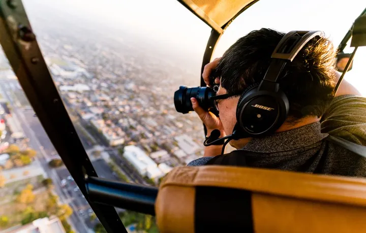 Doors-off helicopter charter for professional aerial photography