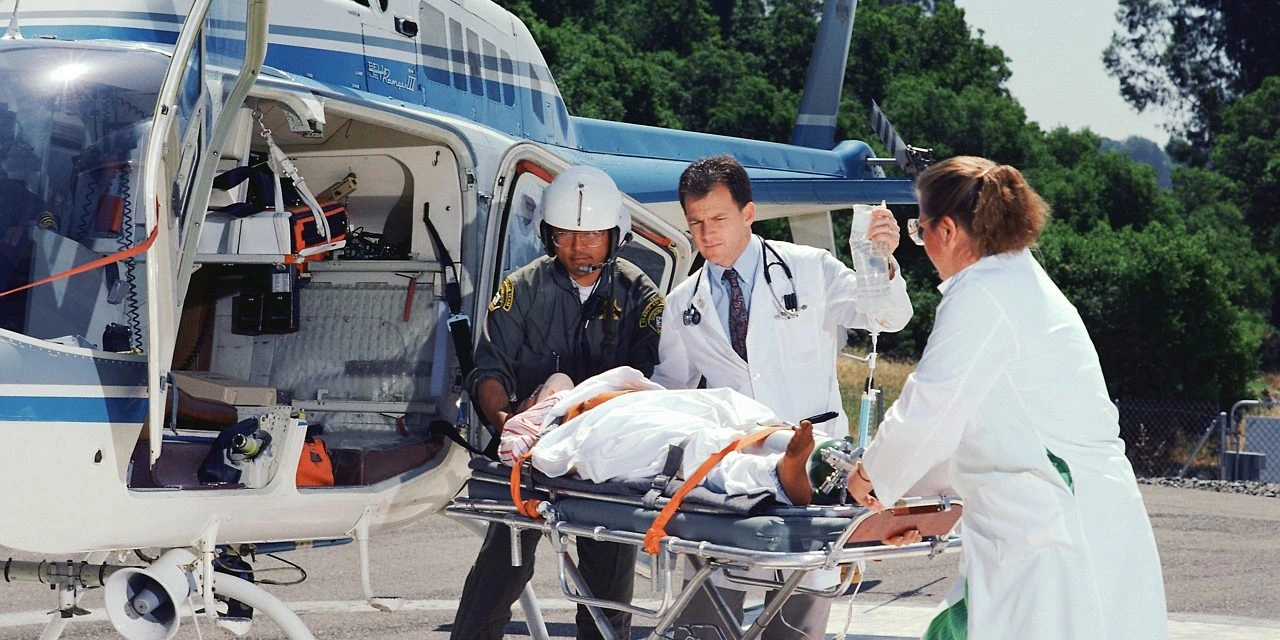 Medical evacuation helicopter over Tanzania landscape